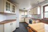 Solides Zweifamilienhaus mit Garten, Garage und Carport in ruhiger Ortsrandlage - Küche_EG
